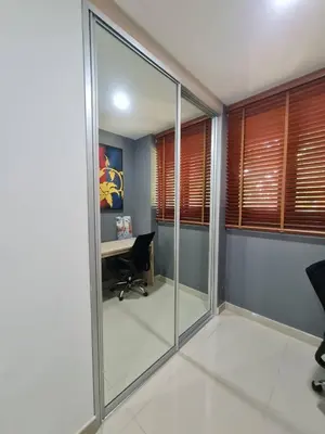 an office with glass walls and a desk at 41 квадратный метр, апартамент на пляже Сурин in Surin Beach