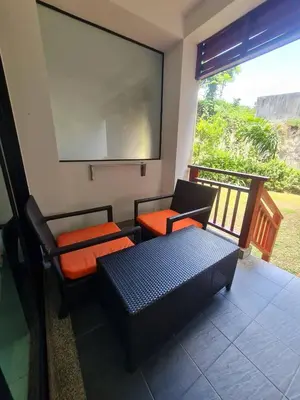 a room with two chairs and a projection screen at 41 квадратный метр, апартамент на пляже Сурин in Surin Beach