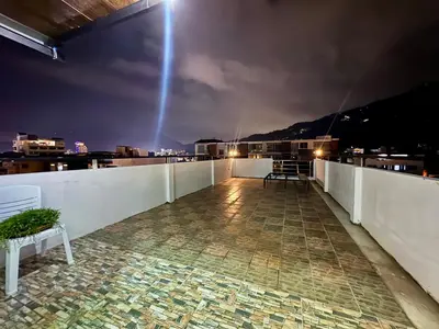 a view from the roof of a building at night at LimeTree Loft Guesthouse in Patong Beach