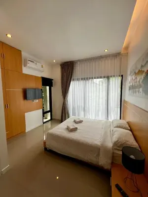 a bedroom with a large bed and a window at Private 2-Bedroom Pool Villa in Rawai, Phuket in Rawai Beach
