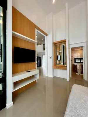 a bedroom with a flat screen tv on a wall at Private 2-Bedroom Pool Villa in Rawai, Phuket in Rawai Beach