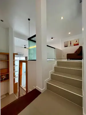 a staircase in a house with a living room at Private 2-Bedroom Pool Villa in Rawai, Phuket in Rawai Beach