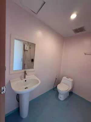 a bathroom with a sink and a toilet at HUG PHIPHI Resort in Phi Phi Don