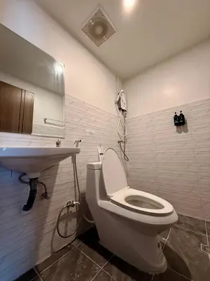 a bathroom with a toilet and a sink at HUG PHIPHI Resort in Phi Phi Don
