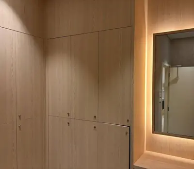 a room with wooden cabinets and a mirror at The Legendary Apartment 209 in Bang Tao Beach
