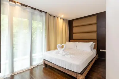a bedroom with a bed with a swan decoration on it at Beautiful Patong Sea View 6 Bedroom Thai Luxury Villa Near Bar Street, Jungceylon in Patong Beach