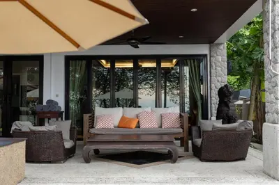 a porch with a couch and chairs on a patio at Beautiful Patong Sea View 6 Bedroom Thai Luxury Villa Near Bar Street, Jungceylon in Patong Beach