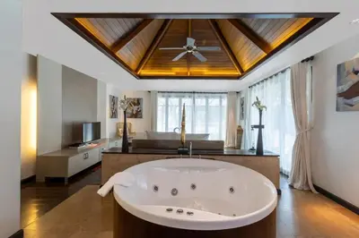 a large white bath tub in a room with a ceiling at Beautiful Patong Sea View 6 Bedroom Thai Luxury Villa Near Bar Street, Jungceylon in Patong Beach