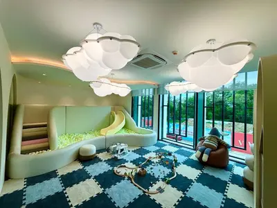 a childrens room with a slide and chandeliers at The Legendary Bang Tao 2-bedrooms apart #701 in Bang Tao Beach