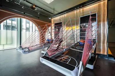 a room with two drying racks in a building at Apartments 15 minutes walk from Bangtao Beach with a cinema in Phuket