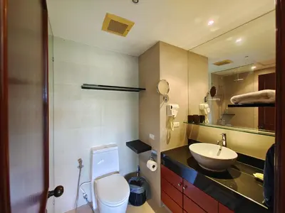 a bathroom with a white toilet and a sink at Apartment 2 bedrooms in Allamanda in Laguna Phuket