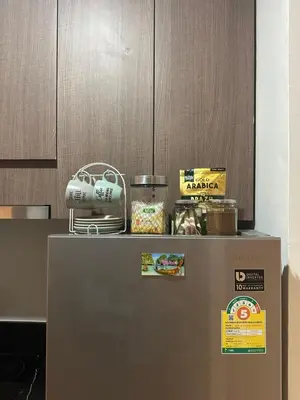 a refrigerator with food on top of it in a kitchen at The Viva Patong Sea view and Mountain views in Patong Beach