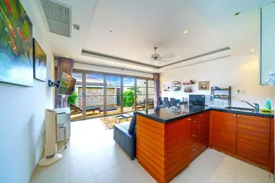 a kitchen with an island in a room at The Residence One-Bedroom Villa in Ban Thalat Choeng Thale