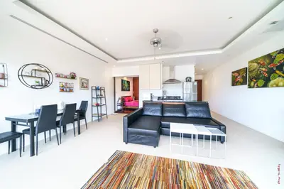 a living room with a couch and a table at The Residence One-Bedroom Villa in Ban Thalat Choeng Thale