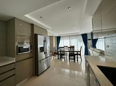 a kitchen with a stainless steel refrigerator and a dining room at Luxury 3 Bed Cherngtalay Villa Pool close to Beaches Dec Holiday Specials in Ban Phru Champa