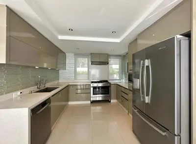 a large kitchen with a stainless steel refrigerator at Luxury 3 Bed Cherngtalay Villa Pool close to Beaches Dec Holiday Specials in Ban Phru Champa