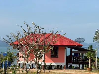 a red and white house with a red roof at The Good View Koh Yao Noi in Ko Yao Noi