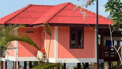 a house with a red roof at The Good View Koh Yao Noi in Ko Yao Noi