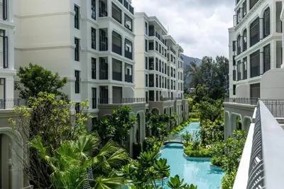 an apartment complex with a river between two buildings at Family Deluxe close to Bang Tao Beach in Bang Tao Beach
