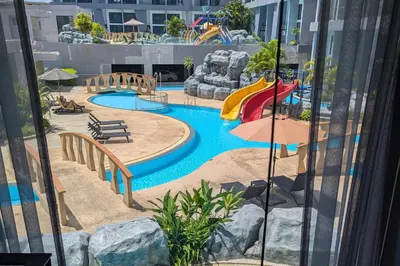a water park with a slide and a playground at Pool Access 1 Bedroom Duplex UTL A107 near Nai Harn Beach in Rawai Beach