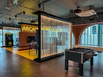 a display case in a room with a ping pong table at Modern 1BR with Pool View The Title Legendary in Bang Tao Beach