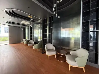 a waiting room with a row of chairs and tables at New Studio in Bellevue Lagoon Phuket in Laguna Phuket