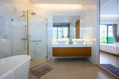 a bathroom with a tub and a sink and a shower at New Luxury Pool Villa Bangtao Phuket in Ban Pak Lak