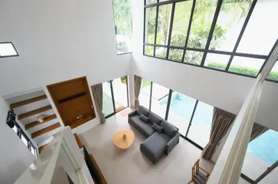 an overhead view of a living room with a couch and a table at New Luxury Pool Villa Bangtao Phuket in Ban Pak Lak