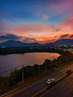 a view of a road with a river and a sunset at The Azure Kathu in Kathu