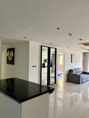 a kitchen with a black counter top in a living room at Apartment with sea view 2 beds in Kamala Beach