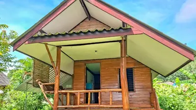 a small house with a large roof at Affordable shack in Ban Laem Sai