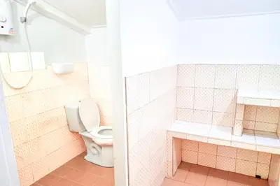 a bathroom with a toilet and a sink at Affordable shack in Ban Laem Sai