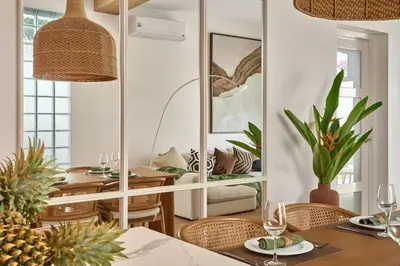 a dining room with a table and a mirror at Villa Moana 2BR Private Pool Naiharn beach in Rawai Beach