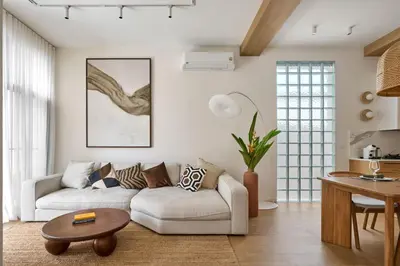 a living room with a couch and a table at Villa Moana 2BR Private Pool Naiharn beach in Rawai Beach