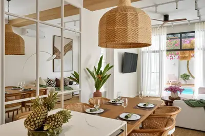 a living room with a table and chairs and a dining room at Villa Moana 2BR Private Pool Naiharn beach in Rawai Beach