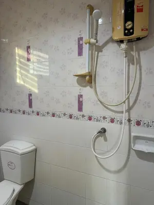 a bathroom with a shower and a toilet at Kamala Charming Local House near Kamala Beach in Kamala Beach