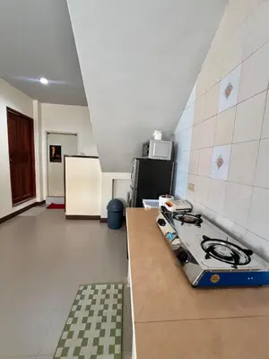 a kitchen with a stove top in a room at Kamala Charming Local House near Kamala Beach in Kamala Beach