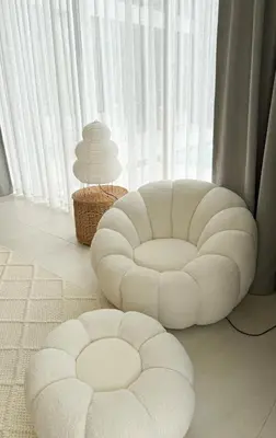 a white chair and a ottoman in front of a window at Lake View Landscape Modern villa Bang Tao in Ban Thalat Choeng Thale