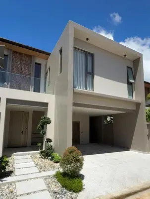 a large white house with a driveway at Lake View Landscape Modern villa Bang Tao in Ban Thalat Choeng Thale