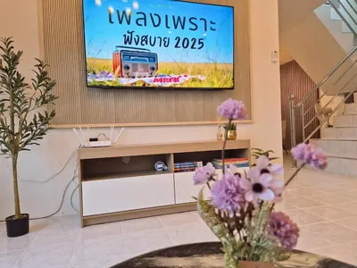a flat screen tv on a wall in a living room at 4 bedroom Lucky House Patong in Patong Beach