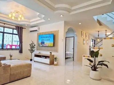 a large living room with a tv on a wall at 4 bedroom Lucky House Patong in Patong Beach
