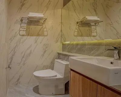 a bathroom with a white toilet and a sink at Holiday Villa 2-BR J10, Private Pool, Rawai Beach in Phuket Town