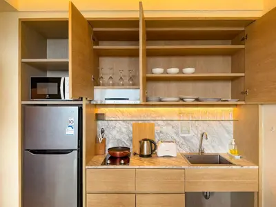a kitchen with a stainless steel refrigerator and a sink at Luxury room with Seaview in Ao Nang Beach