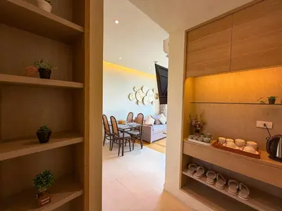 a hallway with a dining room and a living room at Luxury room with Seaview in Ao Nang Beach