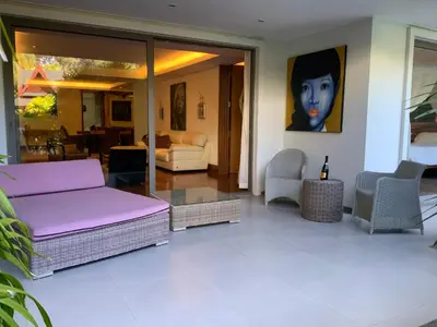 a living room with a purple couch and chairs at Pearl of Nai Thon in Nai Thon Beach