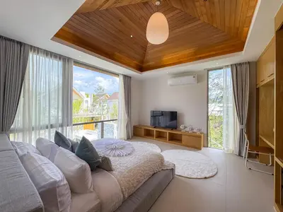 a bedroom with a large bed and a large window at NEW! Luxury Pool Villa 4 Bedrooms in Lux Pride L27 Residence in Ban Pak Lak
