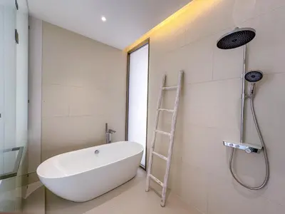 a bathroom with a white bath tub and a ladder at NEW! Luxury Pool Villa 4 Bedrooms in Lux Pride L27 Residence in Ban Pak Lak