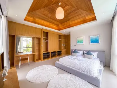 a bedroom with a large bed and a wooden ceiling at NEW! Luxury Pool Villa 4 Bedrooms in Lux Pride L27 Residence in Ban Pak Lak