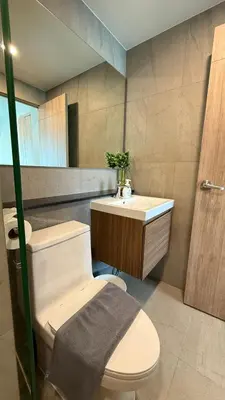 a bathroom with a toilet and a sink at Space Cherngtalay Condo in bangtao by sahana in Bang Tao Beach