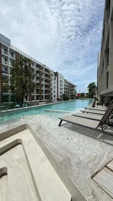 an empty swimming pool in a large building at Space Cherngtalay Condo in bangtao by sahana in Bang Tao Beach